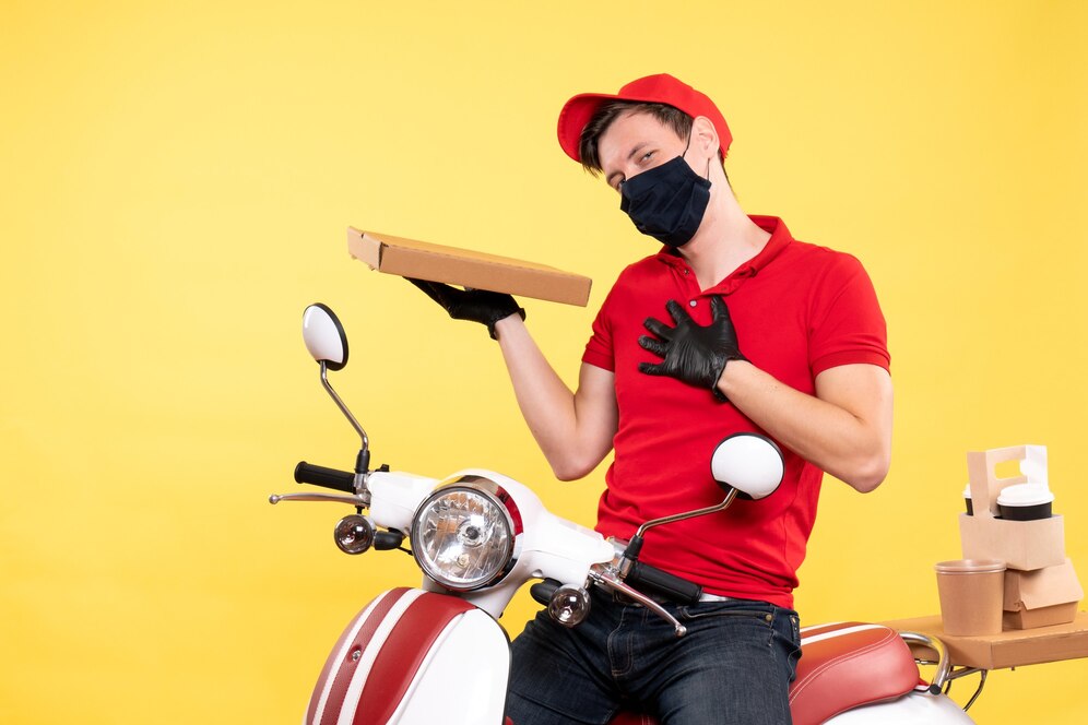 A food delivery guy holding a food box