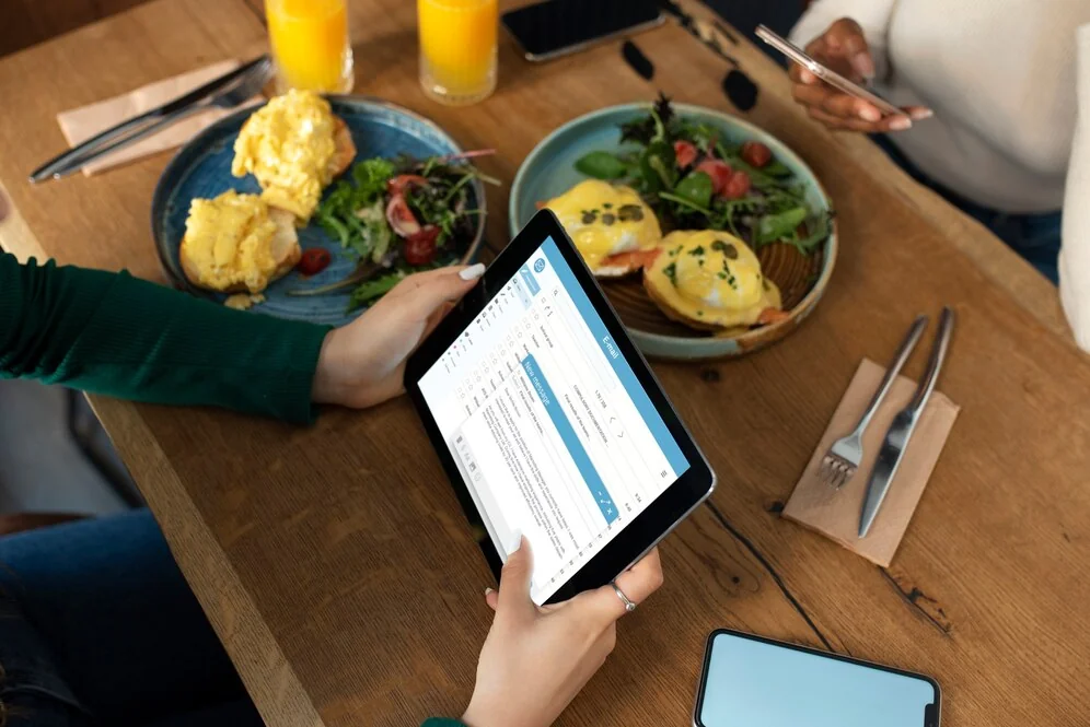 a person going through an email as part of a marketing strategy for a small restaurant