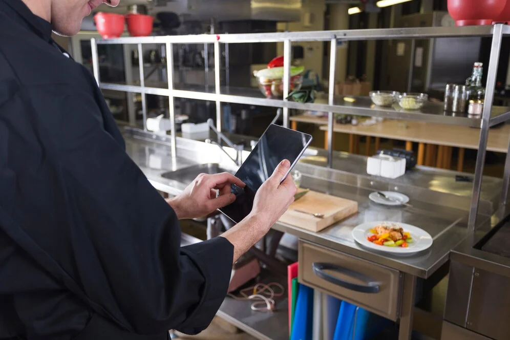 restaurant manager checking the inventory for any potential disruptions